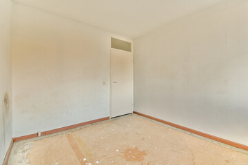 an empty room with white walls and peeling paint on the floor in this photo, there is no one door