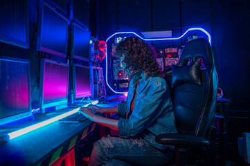 Fototapeta premium an asian woman programmer is working in her computer room , futuristic technology concept