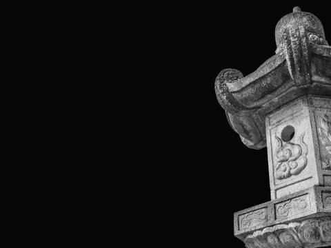 Old traditional japanese stone lantern, a type often find in gardens (Black and White with copy space)
