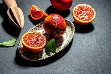 Ripe red oranges. blood orange slice on a dark background. banner, menu, recipe place for text, top view