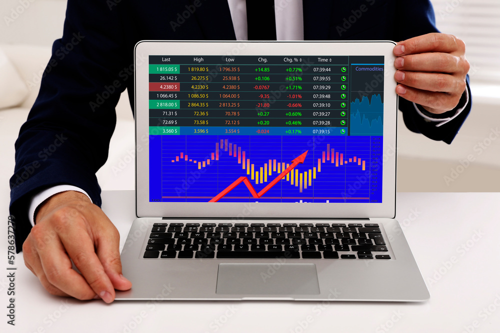 Poster stock exchange. man showing data and graph on screen via laptop, closeup