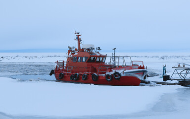 red ship stuck in the sea ice, Hailuoto, Finland