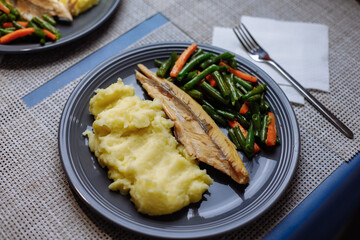Potatoes with fish sauce and vegetables