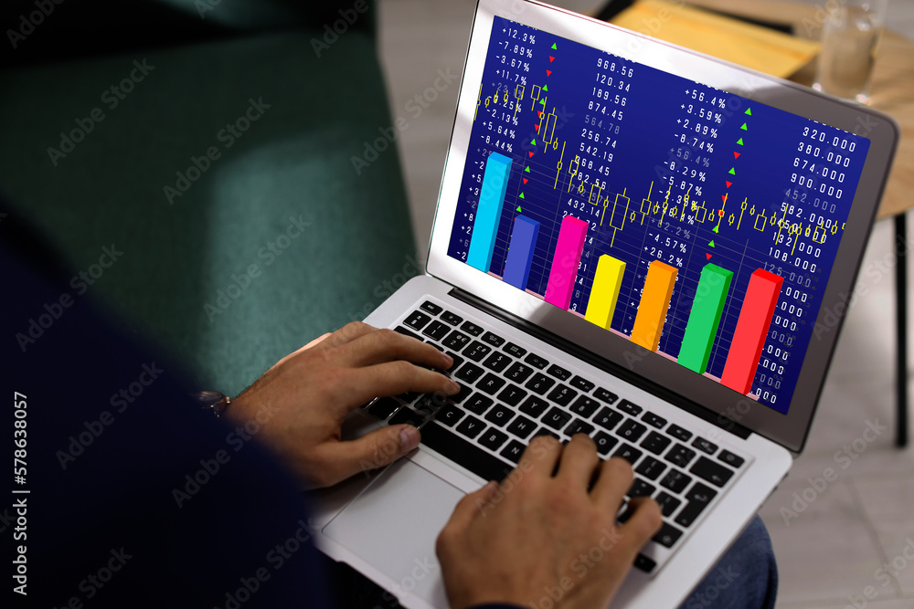 Poster man analyzing situation on stock exchange market via laptop, closeup. data and graph on screen