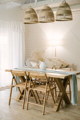 modern wooden house. Rich Scandinavian-style interior with wooden table in the living room