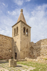 Fototapeta na wymiar The bell tower of the old Franciscan monastery in the abandoned old town of Pag