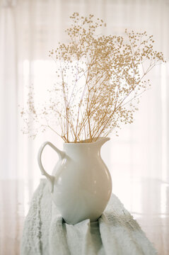 A Bouquet Of Gypsophila In A White Jug On The Background Of The Window