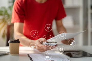 Businessman using mobile phone play social in office.