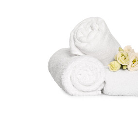Soft terry towels with beautiful flowers on white background
