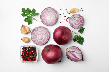 Fresh red onions, garlic, parsley and spices on white background, flat lay