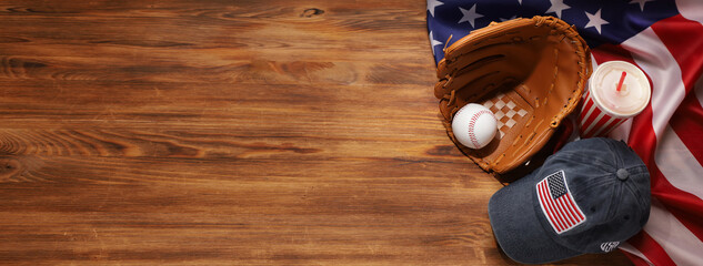Fototapeta na wymiar Baseball ball in a glove on the wooden table. USA flag.