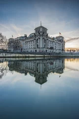 Deurstickers Center of Berlin with river Spree in the evening at sunset. Government building with reflection on water surface. Reichstag of the capital of Germany on a winter day © Marco
