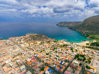 Aerial photos of Tarrafal in Santiago Island, Cabo Verde showcase the stunning beaches and clear waters of this idyllic coastal town, as well as its colorful buildings, charming streets