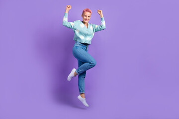 Full body size photo of carefree optimistic hipster lady raise fists up celebrate her lucky victory awesome prize isolated on purple color background