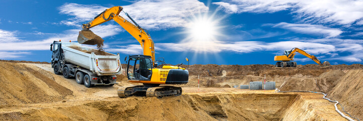  excavator is working and digging at construction site