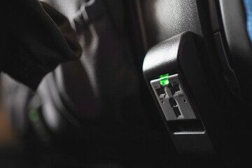 Universal power port behind the aircraft seats