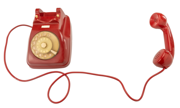 Old red rotary dial telephone with handset and cord, cut out