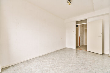 an empty room with white walls and no one door on the other wall in this photo is taken from inside
