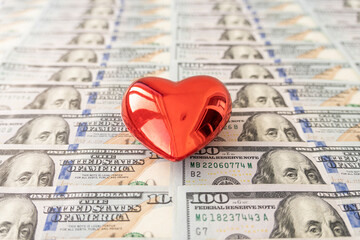 valentine's day, love of money. Love and money concept. Heart and American currency close up
