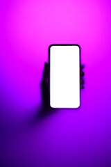 Phone in hand in neon fog - 578657818