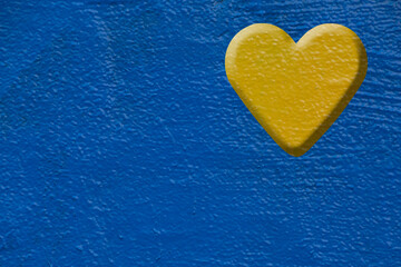blue painted wall with yellow heart