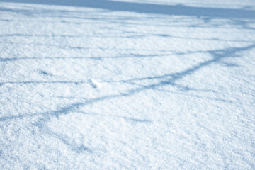 Snowdrift surface on a sunny summer day with shadows