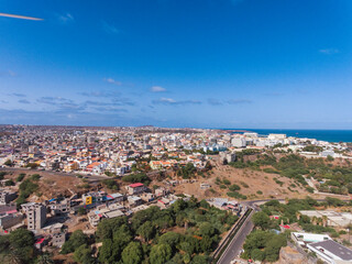 Fototapeta na wymiar Aerial photos of Praia, the capital city of Santiago Island, Cabo Verde, reveal a bustling metropolis with a vibrant culture, stunning architecture, and breathtaking views of the Atlantic Ocean.