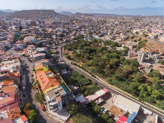 Aerial photos of Praia, the capital city of Santiago Island, Cabo Verde, reveal a bustling metropolis with a vibrant culture, stunning architecture, and breathtaking views of the Atlantic Ocean.