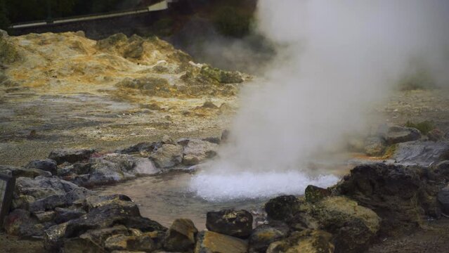 Volcanic Bubbling and boiling water with splashes, close-up.