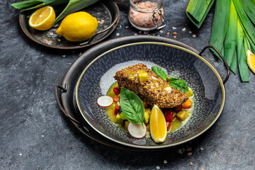 fish fillet breaded in nuts with pepper sauce and vegetables, Healthy fats, clean eating for weight loss, Ketogenic diet food. Restaurant menu, dieting, cookbook recipe top view