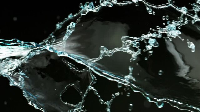 Super Slow Motion Shot of Spiral Water Splash Isolated on Black Background at 1000fps.
