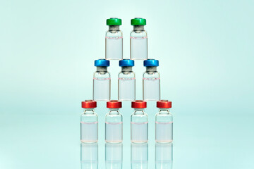 A collection of multi-purpose transparent bottles with colored caps, standing and arranged and on...