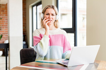 pretty young woman working at home with a laptop. house interior design