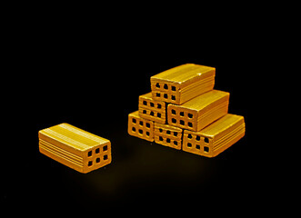 Isolated golden bricks 3D real estate financial concept for investment, property and wealth