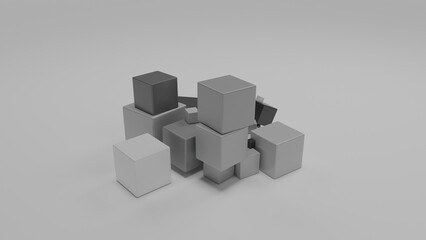 3d rendering of a set of monochrome cubes on a white surface. Cubes in a color range from black to white. Abstract composition.