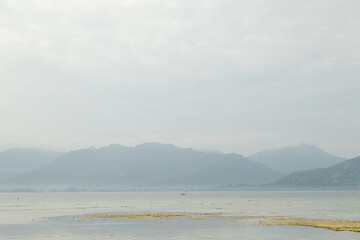 Lombok and Gili Air islands, overcast, cloudy day, sky and sea. Sunny day, sand beach.