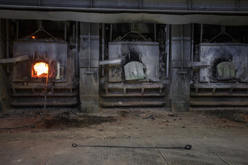 Reverberatory gas furnace for remelting copper scrap and recycled copper.