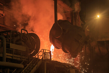 Casting ladle in steel mill workshop.