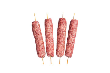Raw kofta or lula kebabs skewers on butcher board. Isolated, transparent background