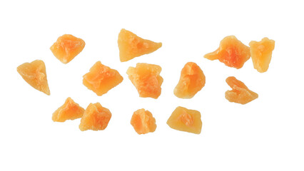 Candied melon pieces with sugar flying isolated on white background. Healthy dessert with fiber and vitamin.