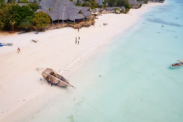 Papier peint adhésif Plage de Nungwi, Tanzanie The picturesque Nungwi beach in Zanzibar, Tanzania is showcased in a toned aerial view image, highlighting the luxury resort and turquoise ocean waters.