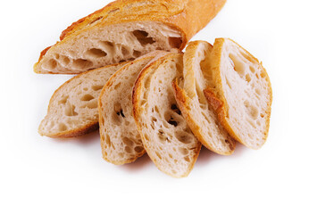 Sliced traditional french baguette on white