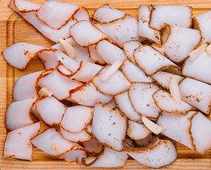 Tasty salted smoked lard on wooden surface