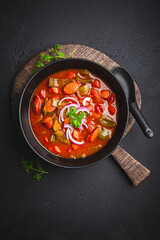 Traditional Solyanka soup - thick and sour soup of Russian origin