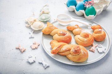 Easter baking - Buns made from yeast dough in a shape of Easter bunny and colored eggs