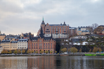 Fototapeta premium Stockholm Gamla Stan buildings at waterfront with reflections, Sweden