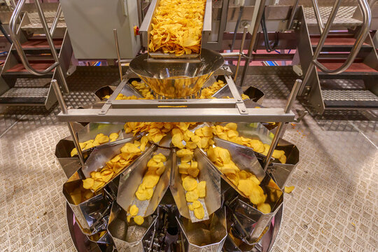 Bucket machine for measuring potato chips.
