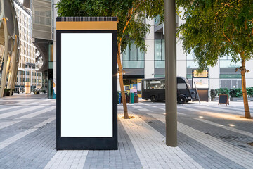 Electronic modern empty scoreboard on the background of a city street. Blank mock up of vertical...