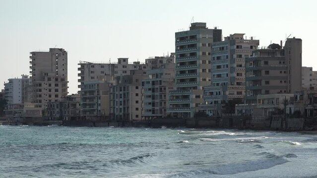 Damaged apartment buildings and hotels at the beach in Varosha, a long abandoned 'ghost town' in Famagusta, conflict and politics Cyprus Europe