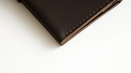 Details of brown elegance men's leather wallet on a white background. Mens leather accessories. Natural leather.